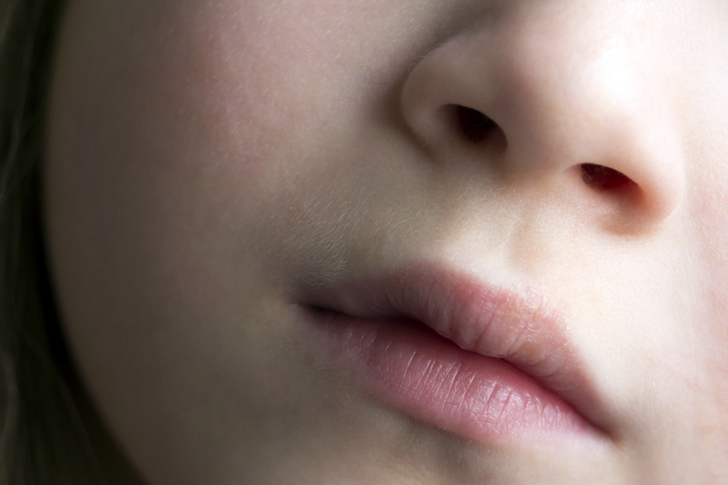 Frauengesicht mit Closeup von Nase und Mund